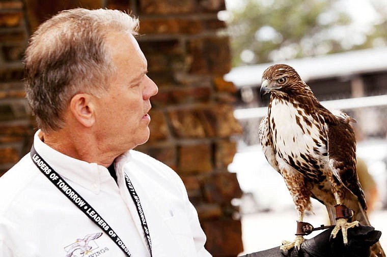 &lt;p&gt;Keith Kratzer of Montana Wild Wings Recovery Center holds a red-tailed hawk during an open house for the center Saturday afternoon at the Fish, Wildlife and Parks headquarters in Kalispell. The event had educational raptor presentations as well as a silent auction to help raise money for the volunteer-run organization. The birds shown by Montana Wild Wings were recovered with injuries too severe to survive in the wild after rehabilitation.&lt;/p&gt;