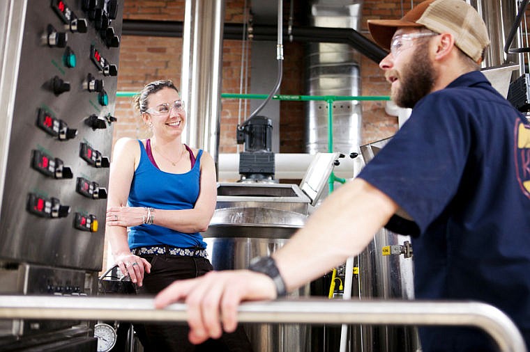 &lt;p&gt;Maggie and Cole laugh while waiting to add hops to the mash Thursday evening at Kalispell Brewing Company. Hops are added at three different stages in boiling process for the dunkel style beer being brewed. &quot;This is the first beer brewed in dowtown [Kalispell] since 1955. I think it's pretty cool,&quot; Maggie said. May 15, 2014 in Kalispell, Montana. (Patrick Cote/Daily Inter Lake)&lt;/p&gt;