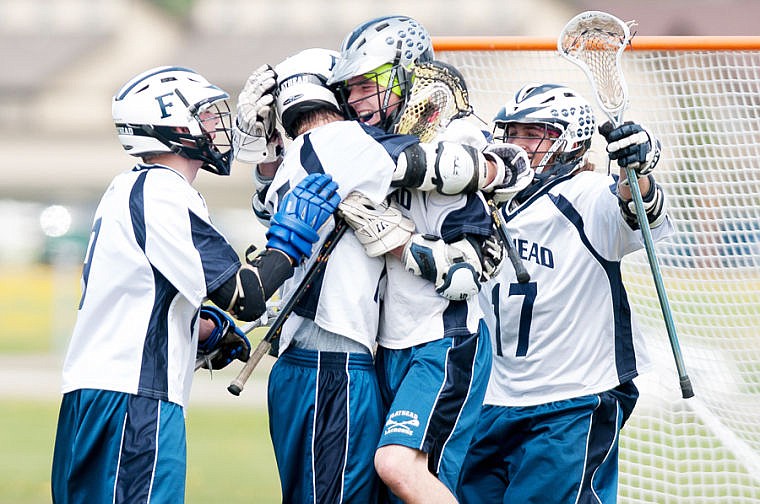 &lt;p&gt;Flathead lacrosse players celebrate a goal Saturday afternoon during their victory over 10 Sticks of Polson at Smith Fields in Whitefish. (Patrick Cote/Daily Inter Lake)&lt;/p&gt;