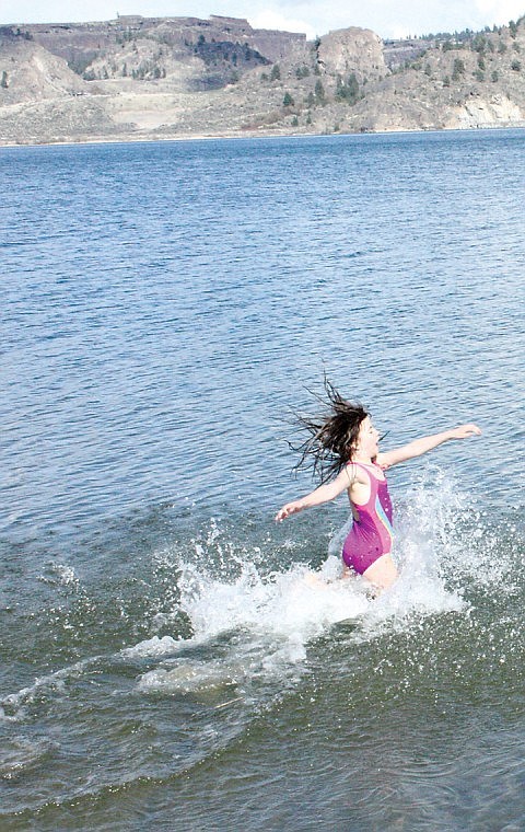 A couple of weeks ago we featured Seattle Daredevil, 9-year-old Livia, who used a rope to swing over Banks Lake before dropping into the cold water. Today Livia's best friend, Amelia, shows off her daredevil tactics by running into Banks Lake for a dip. They continued swinging and running into the water until their teeth chattered and they began to shiver. The following day they two used the rope to swing over the lake without swim suits, but dry clothing on, to see if they could make it back to dry land without falling into the water. The girls and their parents were camping at Steamboat Rock State Park a couple of weeks ago.