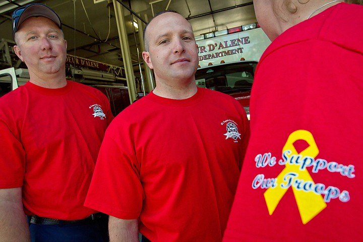 &lt;p&gt;Coeur d'Alene firefighters Jeff Sells, left, and Jesse Freije wear the new Friday uniform shirts that show &quot;We Support Our Troops&quot; on the left sleeve.&lt;/p&gt;