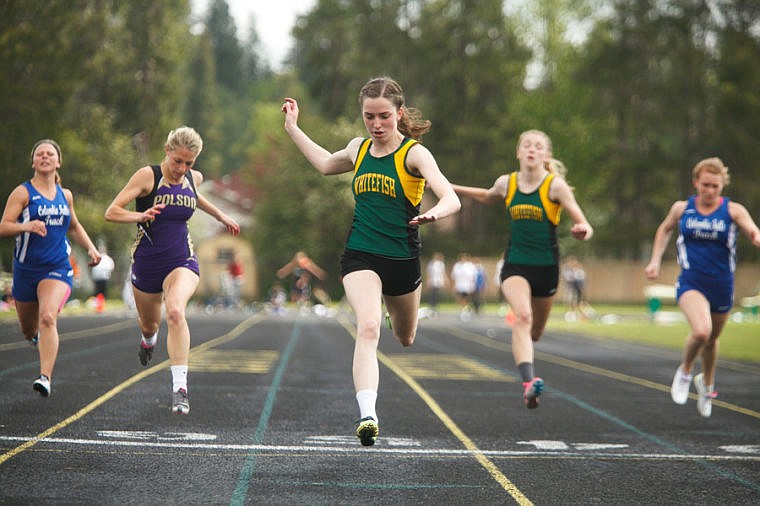 &lt;p&gt;Whitefish junior Marlow Schulz (center) crosses the finish line in first place in the 100-meter dash Saturday afternoon during the second day of the Northwestern A divisional track meet at Whitefish High School.&#160;&lt;/p&gt;