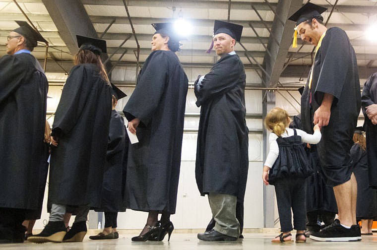 &lt;p&gt;Jackson Hokanson, right, jokes with his daughter Mikayla, 2, Friday night before the Flathead Valley Community College commencement ceremony in the Trade Center at the Flathead County Fairgrounds. Hokanson graduated with an Associate of Arts in Substance Abuse Counseling. May 17, 2013 in Kalispell, Montana. (Patrick Cote/Daily Inter Lake)&lt;/p&gt;