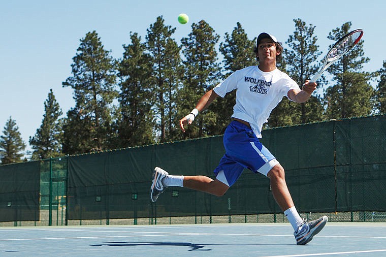 &lt;p&gt;Glacier's Kellen Bates stretches for the ball during his singles championship match Friday afternoon in the divisional tennis tournament at Flathead Valley Community College. (Patrick Cote/Daily Inter Lake)&lt;/p&gt;