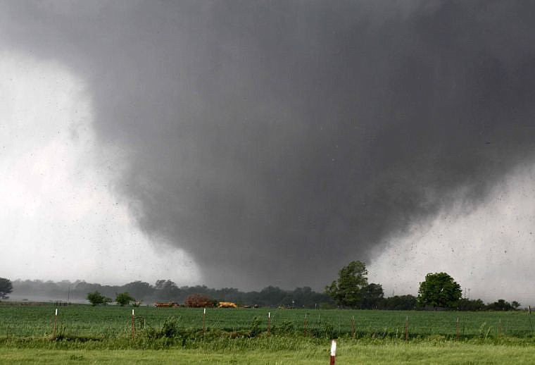 &lt;p&gt;A tornado passes across south Oklahoma City, Monday, May 20, 2013. The monstrous twister roared through the Oklahoma City suburbs, flattening entire neighborhoods with winds up to 200 mph, setting buildings on fire and landing a direct blow on an elementary school. (AP Photo/The Oklahoman, Paul Hellstern)&lt;/p&gt;