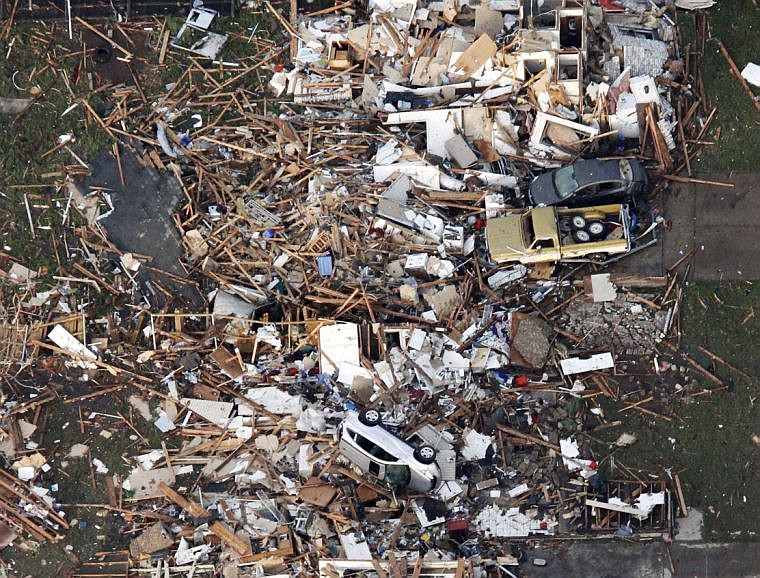 &lt;p&gt;This aerial photo shows the remains of houses in Moore, Okla., following a tornado Monday, May 20, 2013. (AP Photo/Steve Gooch)&lt;/p&gt;