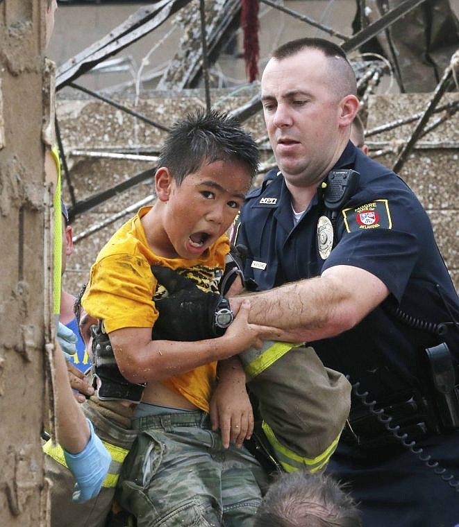 &lt;p&gt;A boy is pulled from beneath a collapsed wall at the Plaza Towers Elementary School following a tornado in Moore, Okla., Monday, May 20, 2013. &#160;(AP Photo Sue Ogrocki)&lt;/p&gt;