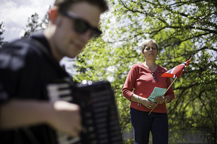 &lt;p&gt;SHAWN GUST/Press Elsie Patrick closes her eyes and listens to Norwegian accordion music being played by Sam Thomas Friday during a Sons of Norway celebration honoring Norwegian Constitution Day at Falls Park in Post Falls.&lt;/p&gt;