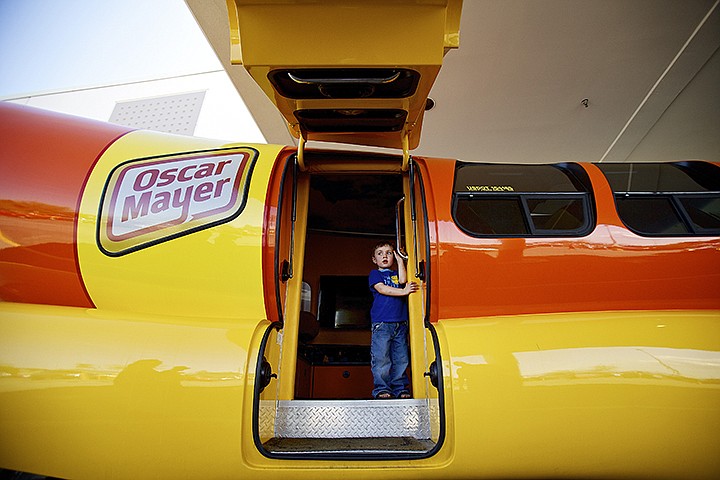 &lt;p&gt;JEROME A. POLLOS/Press Jackson Maxwell, 4, surveys the parking lot from the doorway of the Oscar Mayer Wienermobile that was on display Thursday at Fred Meyer in Coeur d'Alene.&lt;/p&gt;