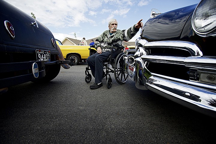 &lt;p&gt;JEROME A. POLLOS/Press Paul Stromenger inspects the hood ornament on a 1950 Ford on display Thursday at Garden Plaza in Post Falls during their celebration for National Nursing Home Week. Organizers arranged a car show, served root beer floats and had a band performing classic songs during the event.&lt;/p&gt;