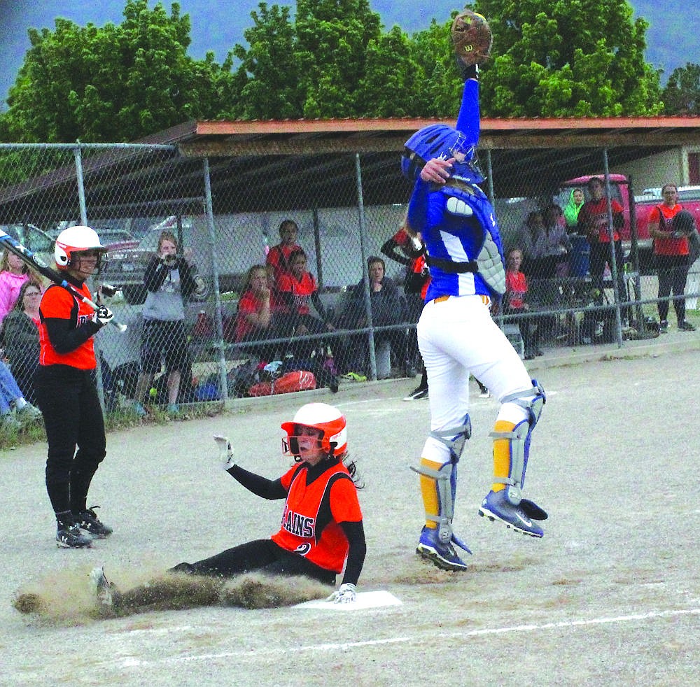 &lt;p&gt;Plains senior Sami Kinzie slides in safe during the Trotters 16-5 win over Thompson Falls.&lt;/p&gt;