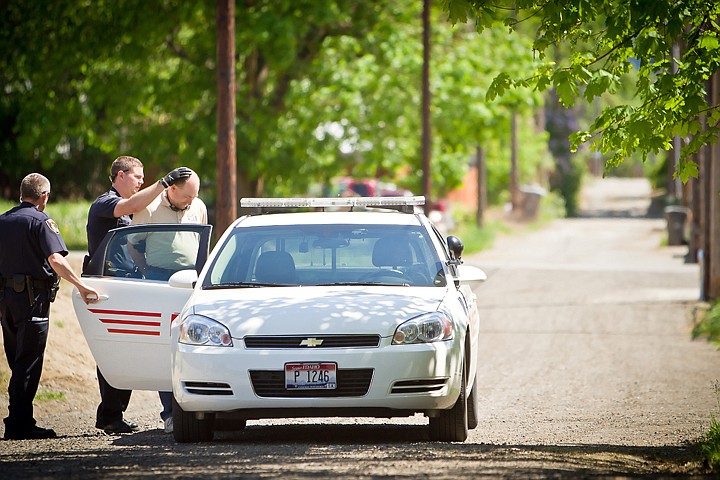 &lt;p&gt;John Hough, owner of The Roosevelt Inn, is placed into the back of a police car following an investigation Wednesday where Hough made threatening comments toward Avista regarding a past due bill. Hough was placed in protective custody and no charges were pending.&lt;/p&gt;