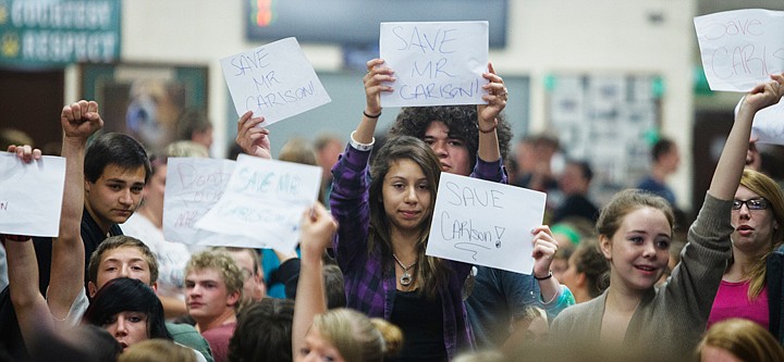 &lt;p&gt;Whitefish High School students hold signs in support of Principal Dave Carlson during a sit-in in the school's common area on Monday morning.&lt;/p&gt;