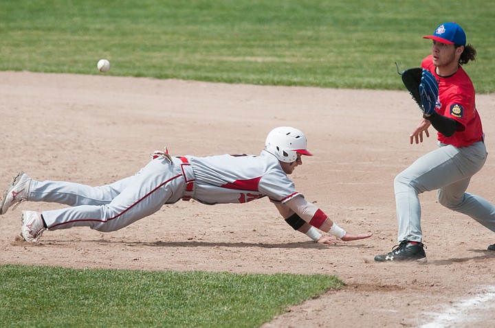 &lt;p&gt;Cody Dopps of the Kalispell Lakers dives safely back to first base Saturday afternoon during the Canadian Days Tournament at Griffin Field.&lt;/p&gt;