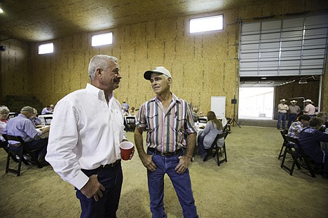 &lt;p&gt;Ron Rosenberger, owner of Rocking R Cattle Company, left, talks with Jim Grast, a retired cattle rancher.&lt;/p&gt;