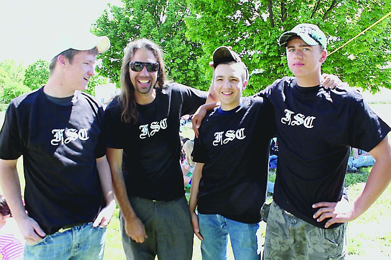 &lt;p&gt;Nathan Freisz (second from left) poses with students at the end of the year awards ceremony held at Plains High School.&lt;/p&gt;