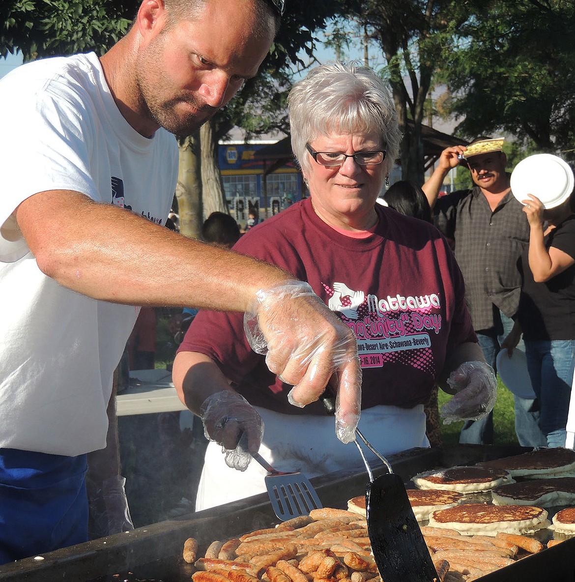 Volunteers serve a free breakfast at the 2015 event.