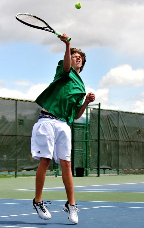 Whitefish's Joel Mallams makes a return during the boys divisional singles championship match at FVCC Friday afternoon.