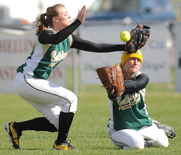 Whitefish shortstop Madison Tveidt, 12, and outfielder Madisen Cross, 9, get blinded by the bright sun and cannot avoid a collision during the game against Libby on Thursday.
