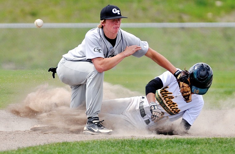 Glacier Twins player Wade Martinson tags Sherwood Athletics player Tom Chodan with an empty glove during the Canadian Days Tournament at the Kidsport Complex Saturday afternoon.