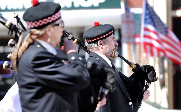 Rod Douglas of Kalispell and members of the Montana Highlanders Pipeband take part in a parade and prayer walk as part of Peace Officers Memorial day on Saturday in downtown Kalispell.