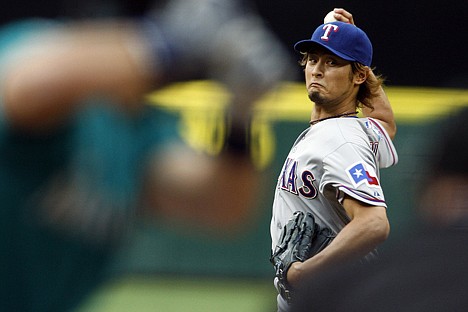 &lt;p&gt;Texas Rangers starting pitcher Yu Darvish throws to Seattle Mariners' Jesus Montero in the first inning during a baseball game in Seattle on Monday, May 21, 2012. (AP Photo/Kevin P. Casey)&lt;/p&gt;