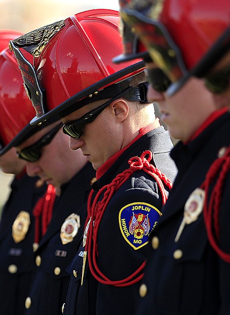 &lt;p&gt;Joplin firefighters bow their heads during a ceremony marking the first anniversary of the EF-5 tornado that killed 161 people, Tuesday, May 22, 2012, in Joplin, Mo. The tornado that cut a wide swath through Joplin is the costliest on record. (AP Photo/Charlie Riedel)&lt;/p&gt;