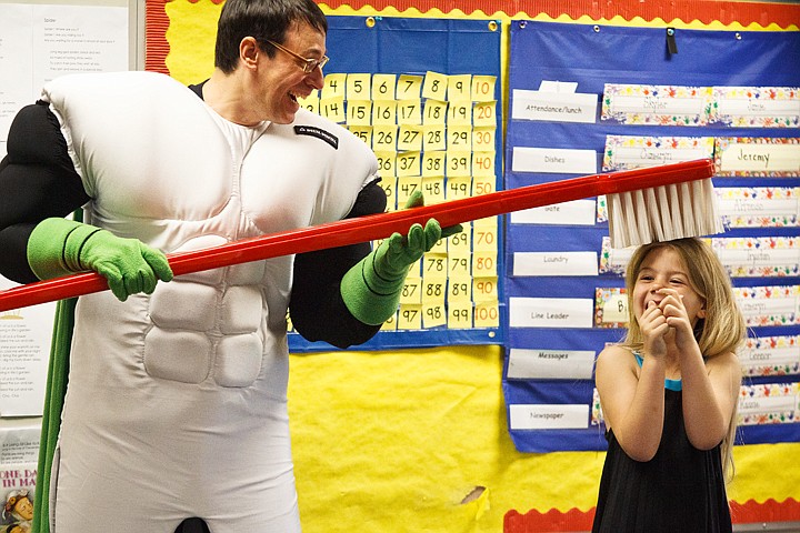 &lt;p&gt;SHAWN GUST/Press Mariah Klepper, a kindergartener at Fernan Elementary School, is brushed by Captain Supertooth, played by actor Nick Garcia, Friday as part of a Delta Dental program to promote good oral care in children.&lt;/p&gt;