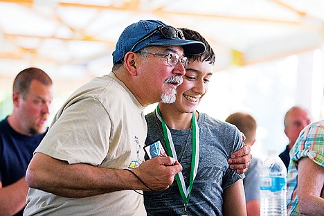 &lt;p&gt;Mike Cuentas hugs his son Sam, 14, after the teen was awarded a plaque in the 12-14 age group of the 2014 Clay Larkin Mayor&#146;s Youth Awards Thursday at Q&#146;emiln Park in Post Falls.&lt;/p&gt;