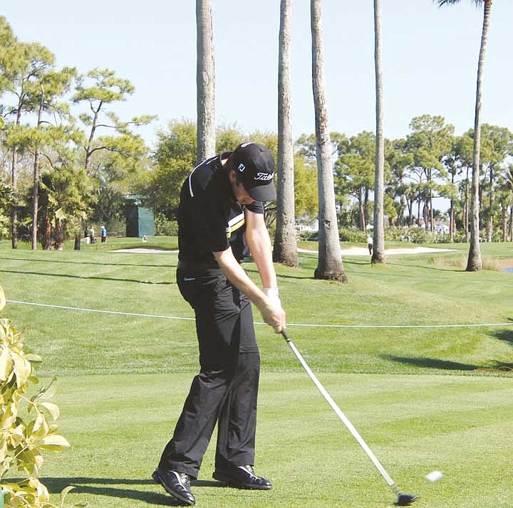 At impact, the full radius has been restored, and the left arm is long again, releasing pent-up power.