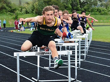 <p>Jansen Anderson competes in the 300 meter hurdles at the Western A track meet in Frenchtown.</p>