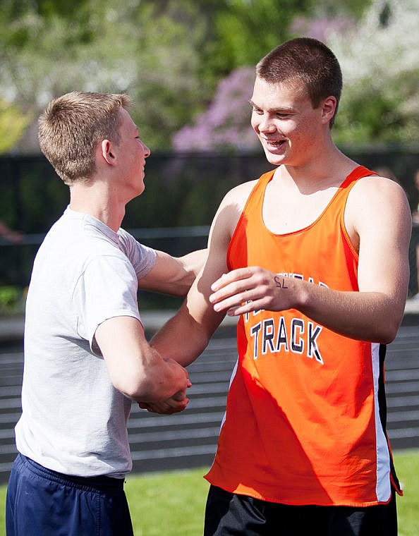 &lt;p&gt;Flathead senior Matt Quist (right) is congratulated after clearing 6'9&quot; in the high jump Friday afternoon during the first day of Western AA Divisional Track at Legends Stadium in Kalispell. (Patrick Cote/Daily Inter Lake)&lt;/p&gt;