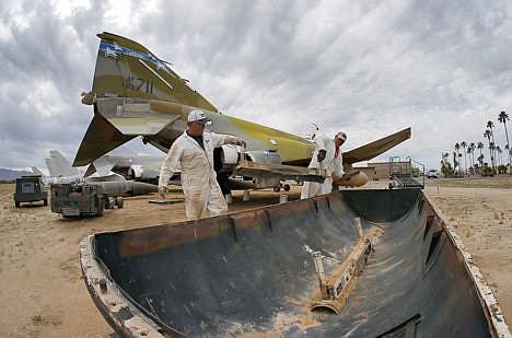 &lt;p&gt;Phil Kovaric and Dennis Varney remove the missile rails from an F-4 Phantom slated for destruction at the 309th Aerospace Maintenance and Regeneration Group boneyard in Tucson, Ariz.&#160;&lt;/p&gt;