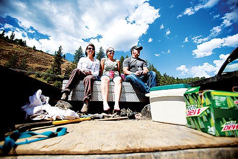 &lt;p&gt;From left, Rina Schaffer, Rose Silvia, and Paul Coward watch the St. Joe River Jet Boat Race from the back of a pickup truck Saturday.&lt;/p&gt;