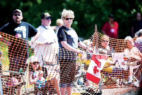 &lt;p&gt;Leona Drolet supports jet boat &#147;Bad Habit&#148; by holding Canadian flags along the finish line of the second leg at the St. Joe River Jet Boat Race. Teams came from Canada, Washington, Oregon and even New Zealand to compete in the race.&lt;/p&gt;