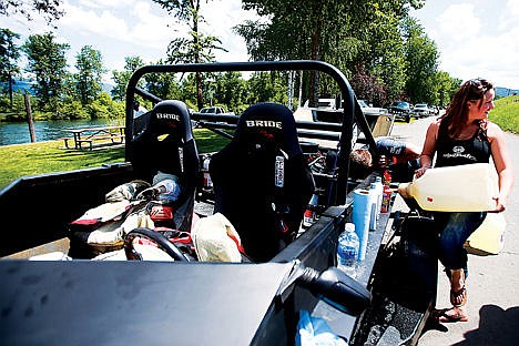 &lt;p&gt;Alison Smith, 17, gasses up her family&#146;s jet boat as Michael Jones searches for an oil leak at the St. Joe River Jet Boat Race Saturday in St. Maries.&lt;/p&gt;