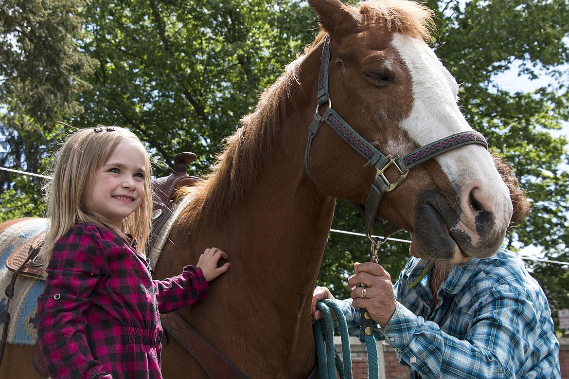 &lt;p&gt;Sorensen Elementary School kindergartener Jamie Jaworski pets Betty the horse Friday, May 20.&lt;/p&gt;