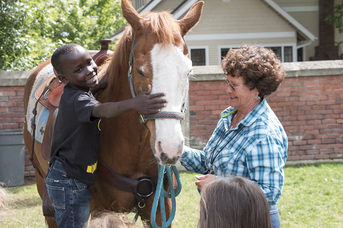 &lt;p&gt;Sorensen Elementary School kindergartener Kado Miller pets Betty, Principal Janet Ackerman&#146;s horse.&lt;/p&gt;