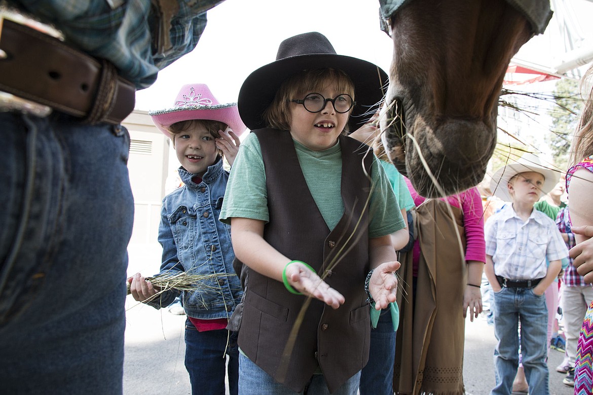 &lt;p&gt;Violet Petersen and Michael Koep feed Betty the horse at Sorensen Elementary School.&lt;/p&gt;