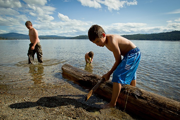 &lt;p&gt;JEROME A. POLLOS/Press Vincent Juarez, 12, plays along the shoreline of the beach at North Idaho College as his friends, James Ashline, 12, and Grace Ashline, 2, wade in the water Wednesday.&lt;/p&gt;