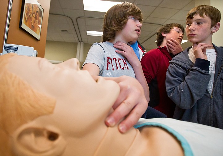 &lt;p&gt;SHAWN GUST/Press Woodland Middle School seventh-graders Chance Kaze, left, Walker Jones, and Tyler Park, right, look for their pulses Tuesday during a tour of the Meyer Health and Sciences building at North Idaho College. The XPLOR NIC program is expected to bring approximately 1,200 middle schoolers through the tour of the campus during the two-day event.&lt;/p&gt;