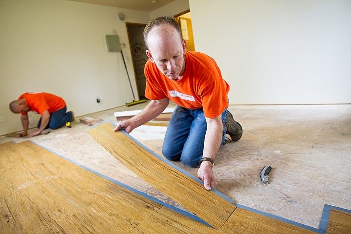 &lt;p&gt;SHAWN GUST/Press Terry Sasser, flooring supervisor for the Home Depot, lays a section of new flooring in a room at the Children's Village thursday as part of the Team Depot event. More than 15 Home Depot employees and family member donated their time to make improvements to the children's home.&lt;/p&gt;