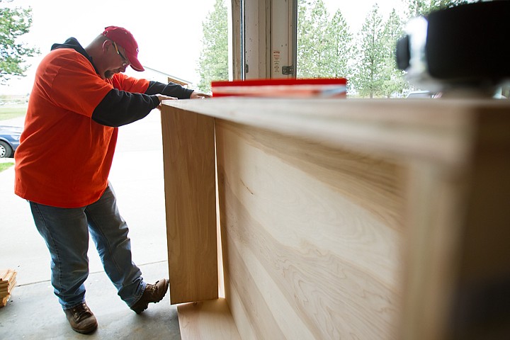 &lt;p&gt;SHAWN GUST/Press David-John Bier, millworks manager for Home Depot, assembles a bookshelf for The Children's Village classroom. The home improvement center donated more than $5,700 worth of supplies and labor as part of Team Depot.&lt;/p&gt;