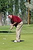 Former mayor and Cougar Classic chairman Wayne Rimple putts on the No. 18 green