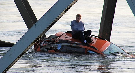 &lt;p&gt;Bryce Kenning, 20, is seen sitting atop a car that fell into the Skagit River after the collapse of the Interstate 5 bridge there minutes earlier Thursday evening in Mount Vernon, Wash.&lt;/p&gt;