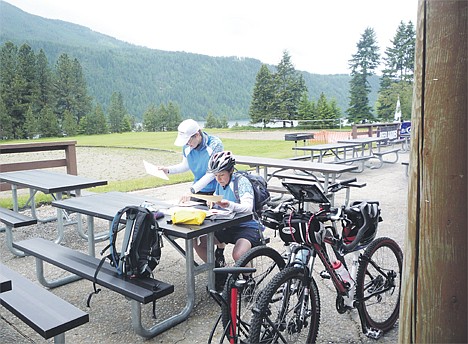 &lt;p&gt;A pair of adventure racers pause in a previous race at Farragut State Park and study a map to see what their next move is.&lt;/p&gt;