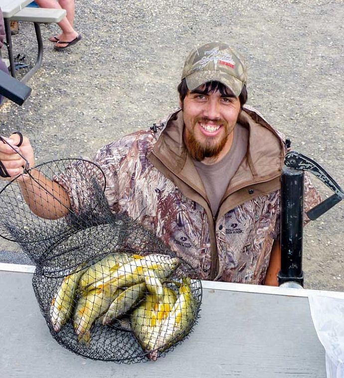 Levi Rodello, of Warden, shows some nice Perch he caught off the dock last Saturday.