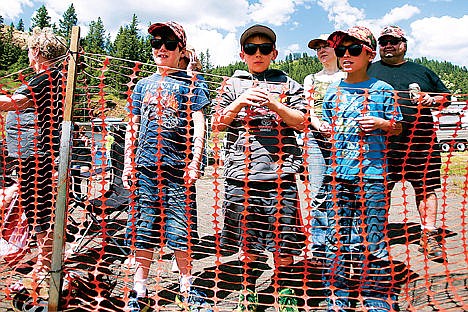 &lt;p&gt;From left, Joseph Orr, Corbin Scheer, and Joshua Orr watch the jet boats as they take off one-by-one after each minute at the starting line located at the Idaho Foresties Industries Landing on the St. Joe River.&lt;/p&gt;