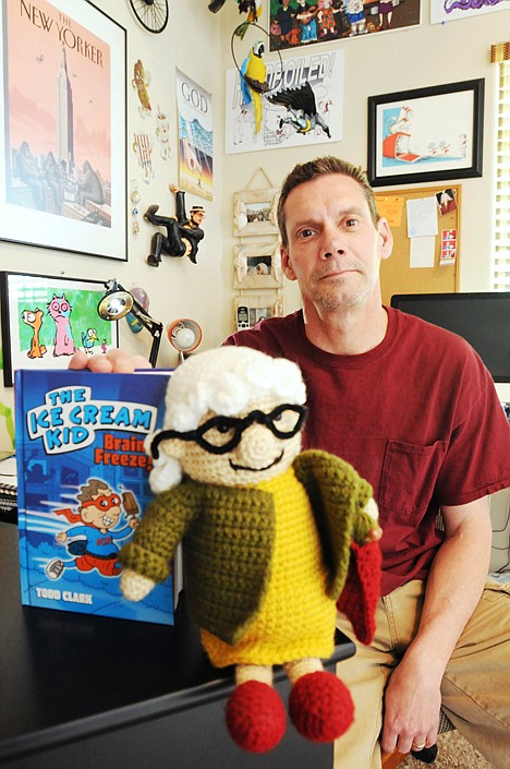 &lt;p&gt;Cartoonist Todd Clark is photographed with a knitted version of his nationally syndicated comic strip character 'Lola' and his upcoming book 'The Ice Cream Kid' Wednesday at his Boise home.&lt;/p&gt;