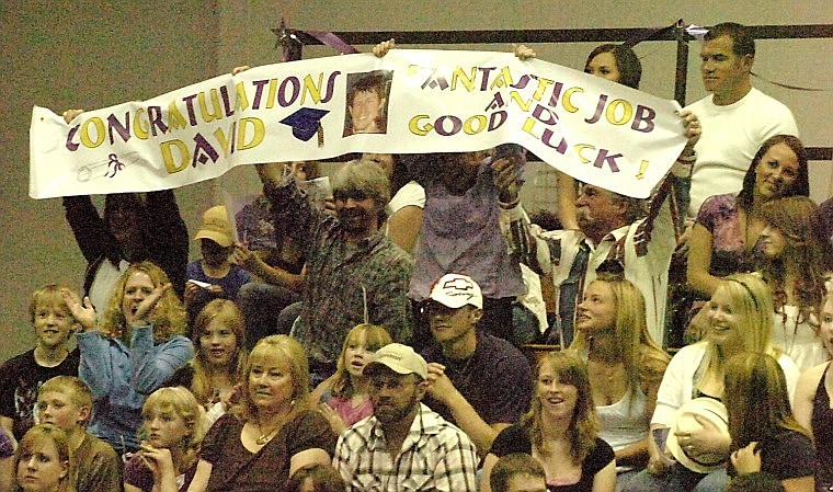 Divid Romie's family shows their support as he graduates.